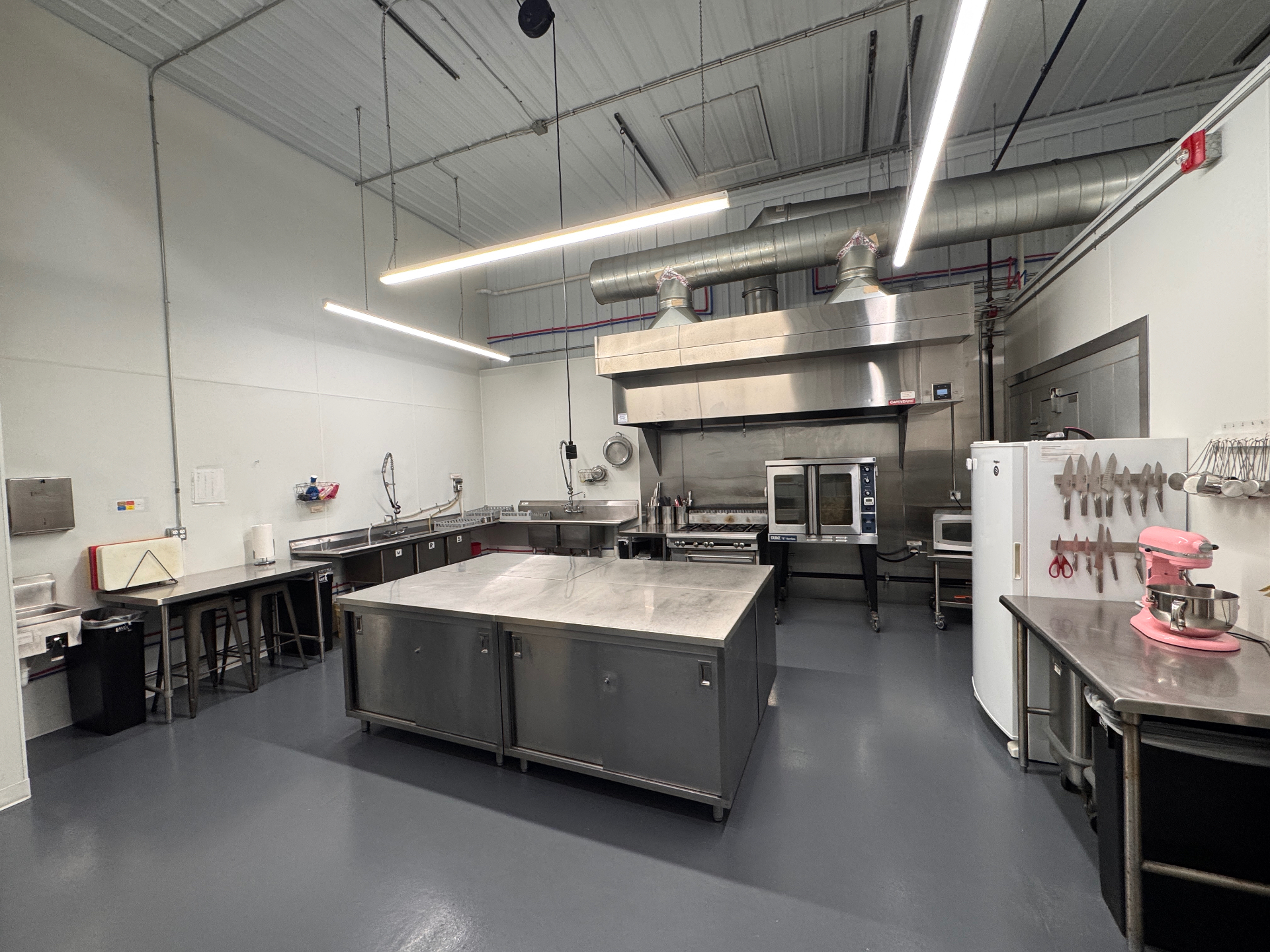 Wild Bramble commercial kitchen with stainless steel prep island