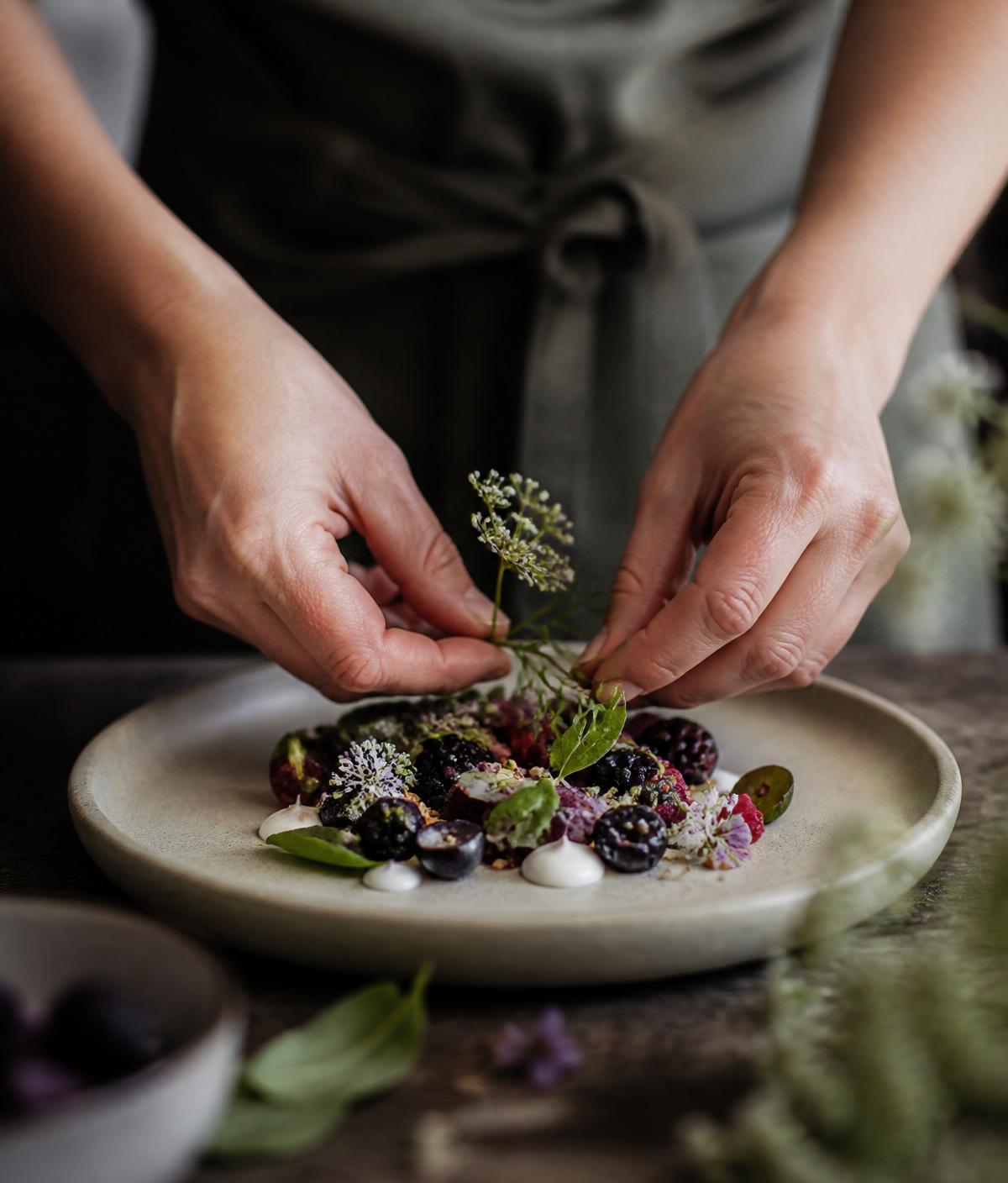 Plating a delicate seasonal gourmet dish